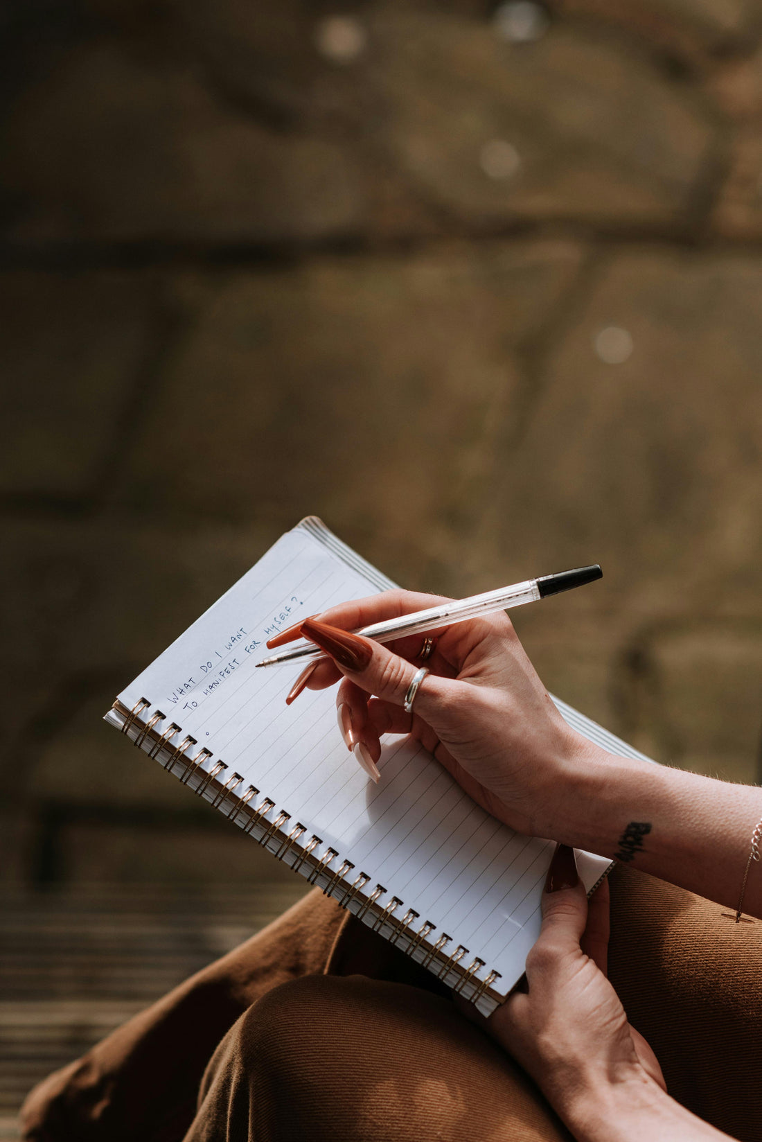 image of someone writing something in a notebook